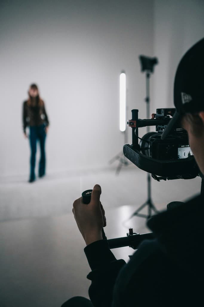 Camera operator filming in studio